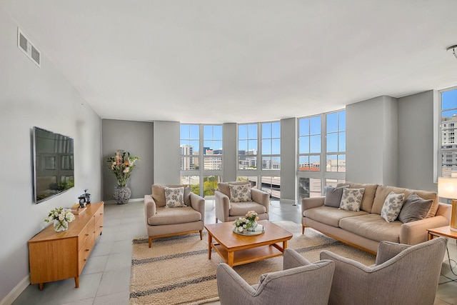 tiled living room with a wall of windows