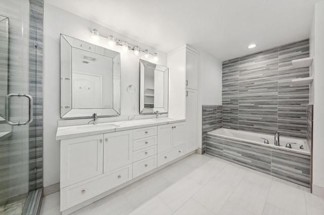 bathroom featuring vanity, tile patterned floors, and independent shower and bath