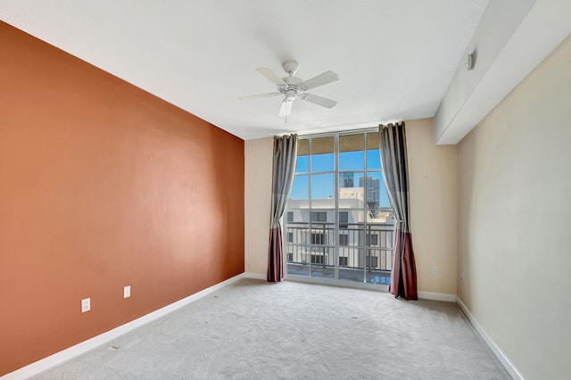 spare room with carpet flooring and ceiling fan