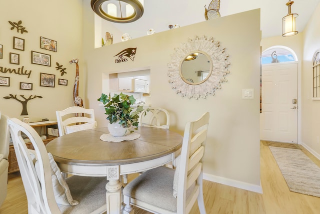 dining space featuring light wood-type flooring