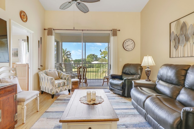 living room with ceiling fan and light wood-type flooring