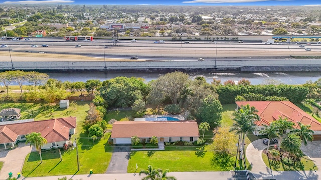 birds eye view of property with a water view