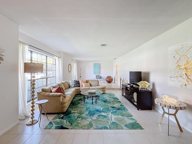 tiled living room with a textured ceiling