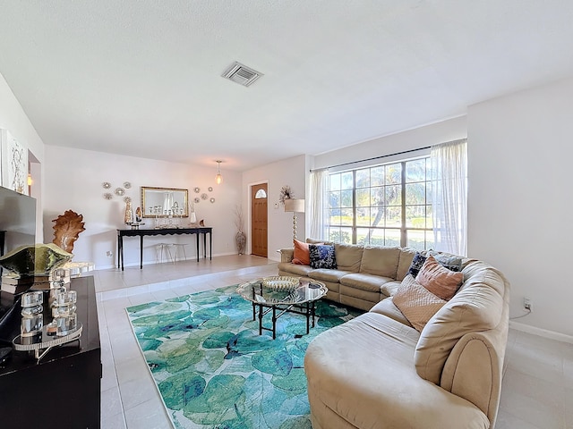 living room with tile patterned floors