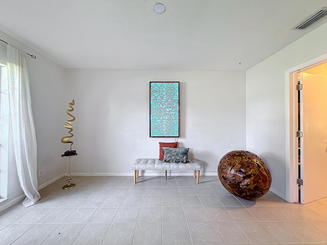 sitting room with light tile patterned flooring