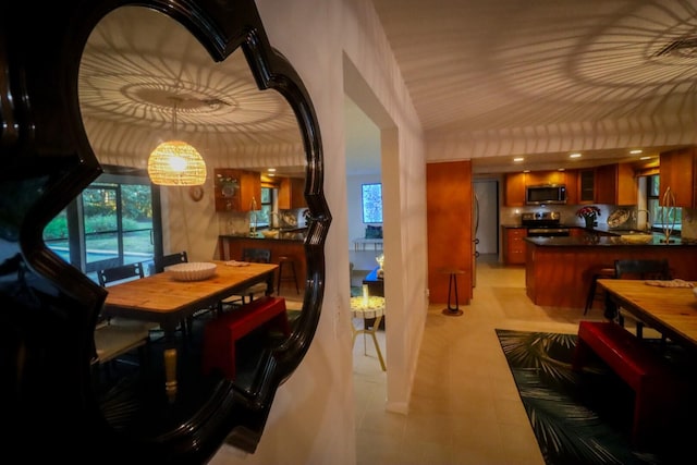 dining room featuring lofted ceiling