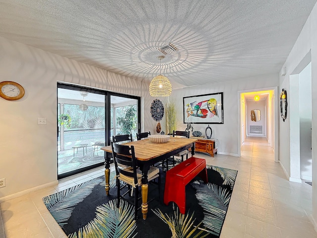 dining space featuring light tile patterned flooring