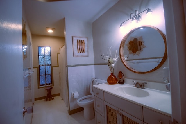 bathroom featuring vanity, tile walls, and toilet