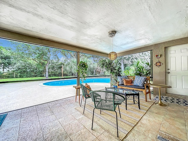 view of pool with outdoor lounge area and a patio area