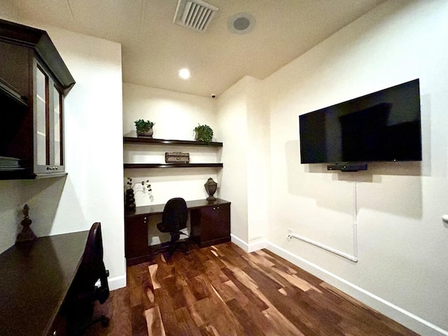 living room with built in desk and dark hardwood / wood-style flooring