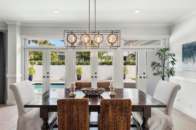 dining room with ornamental molding and french doors