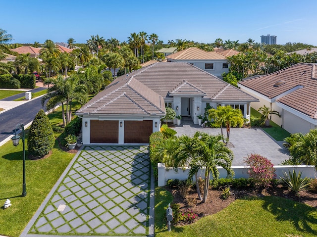 view of front of property with a garage and a front yard