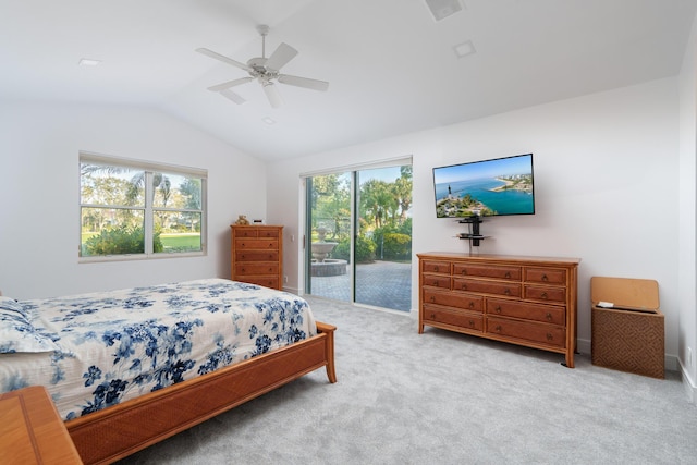 bedroom with light colored carpet, vaulted ceiling, multiple windows, and access to outside