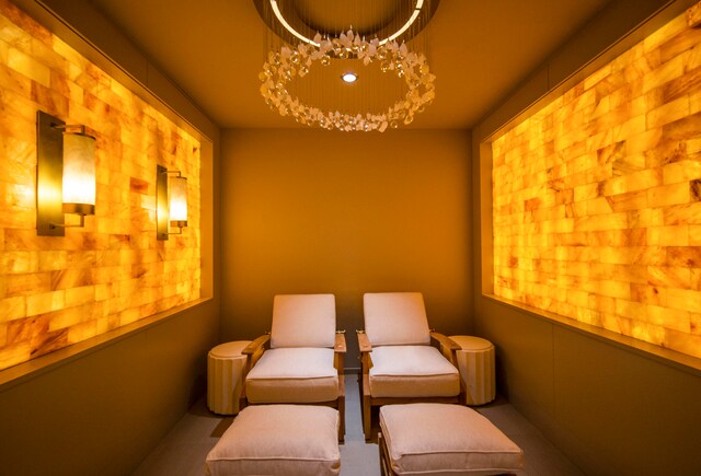 sitting room featuring an inviting chandelier