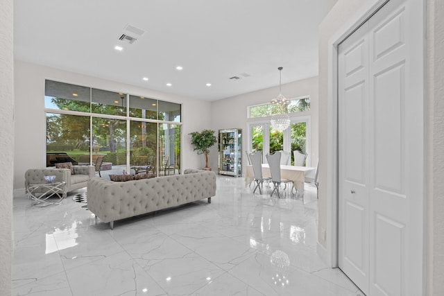 living room featuring a notable chandelier