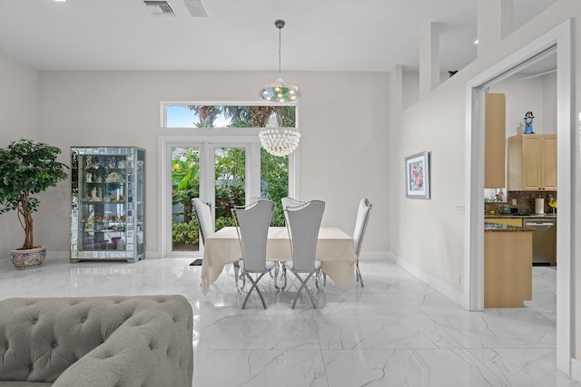 dining room with a notable chandelier