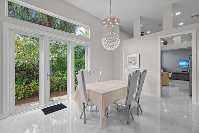 dining area with a notable chandelier