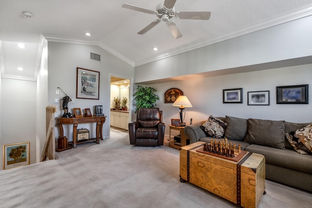 carpeted living room with ornamental molding, ceiling fan, a textured ceiling, and lofted ceiling