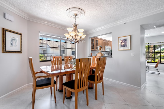 tiled dining room featuring ornamental molding, a notable chandelier, and a textured ceiling