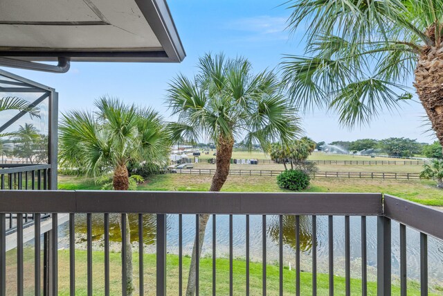 balcony featuring a water view