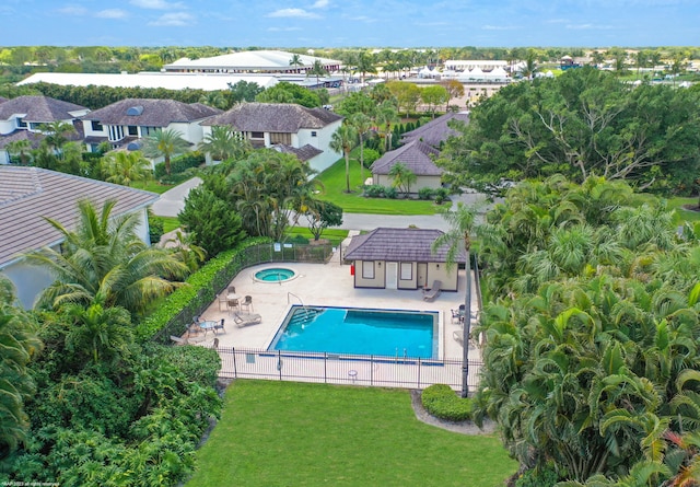 view of swimming pool with a yard and a patio