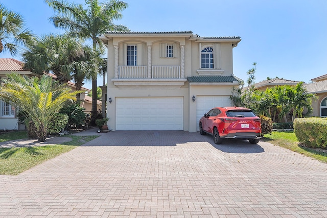 mediterranean / spanish home featuring a garage