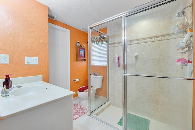 bathroom with a shower with shower door, toilet, a textured ceiling, vanity, and tile floors