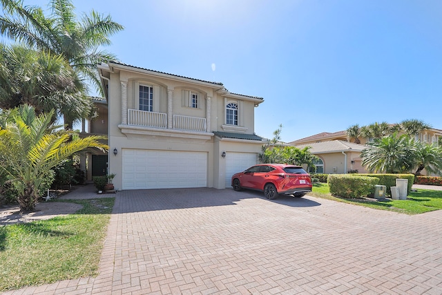 mediterranean / spanish house with a garage