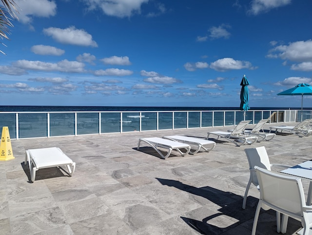 view of patio featuring a water view