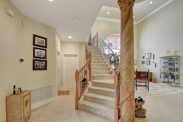 staircase featuring recessed lighting, ornate columns, visible vents, tile patterned flooring, and baseboards