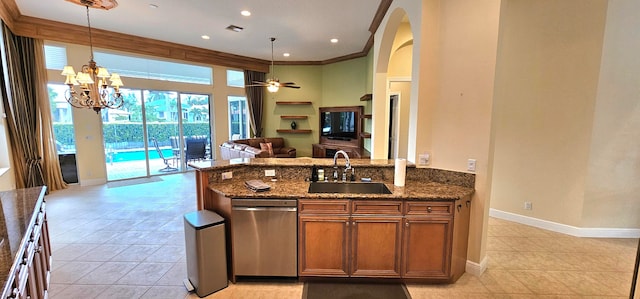 kitchen featuring decorative light fixtures, ceiling fan with notable chandelier, sink, and stainless steel dishwasher