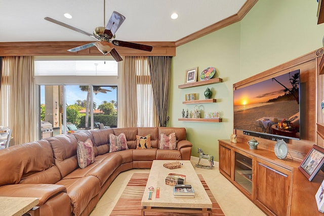 living room with ceiling fan, ornamental molding, a high ceiling, and light tile patterned flooring