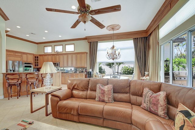 living room with light tile patterned floors, ceiling fan with notable chandelier, a wealth of natural light, and ornamental molding