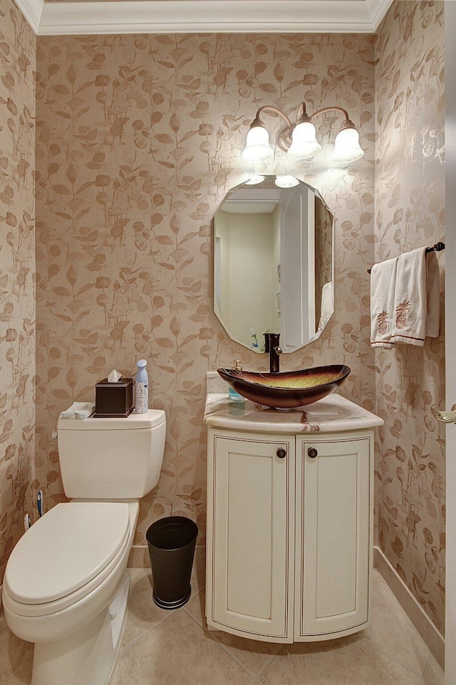 bathroom featuring ornamental molding, vanity, toilet, and tile patterned flooring