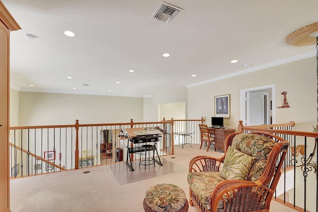 sitting room featuring ornamental molding and light colored carpet