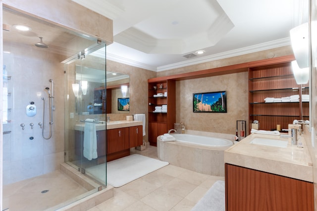 bathroom with oversized vanity, tile flooring, plus walk in shower, a raised ceiling, and ornamental molding