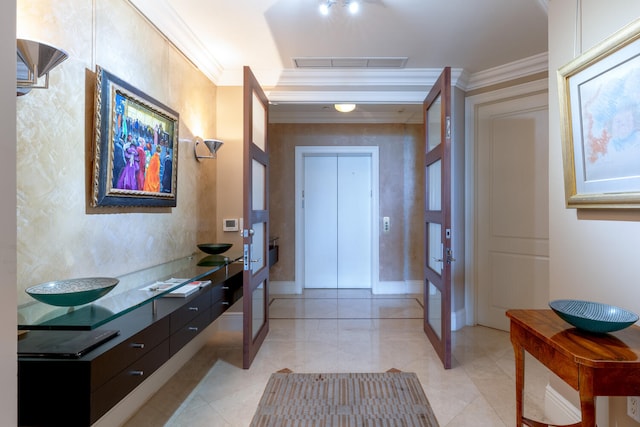 entrance foyer with light tile flooring and crown molding