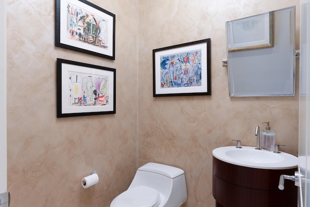 bathroom with vanity and toilet