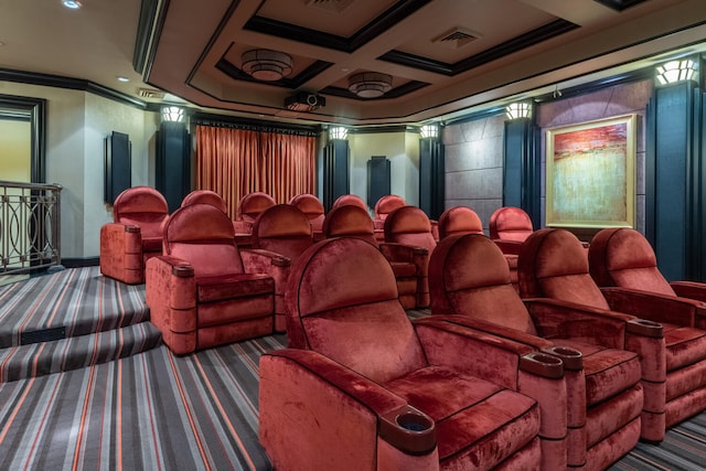 home theater room with dark colored carpet, coffered ceiling, and ornamental molding