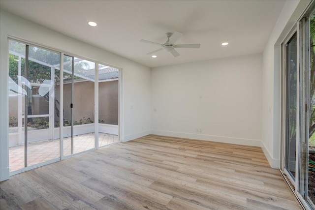 spare room with light hardwood / wood-style floors and ceiling fan