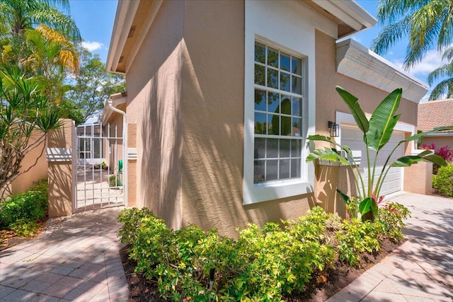 view of side of property featuring a garage