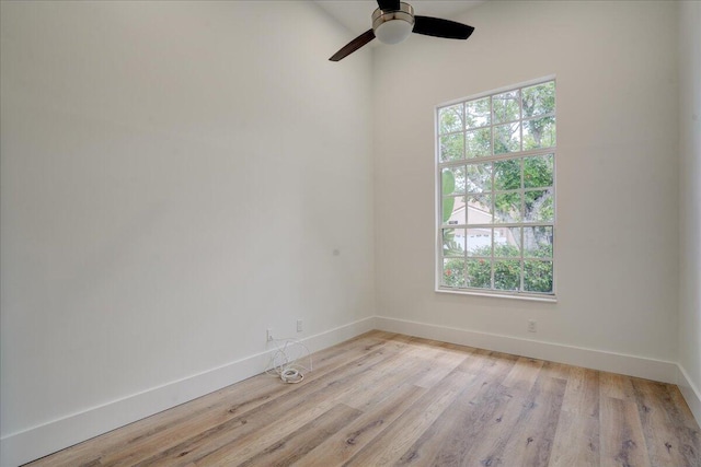 spare room featuring ceiling fan and light wood-type flooring