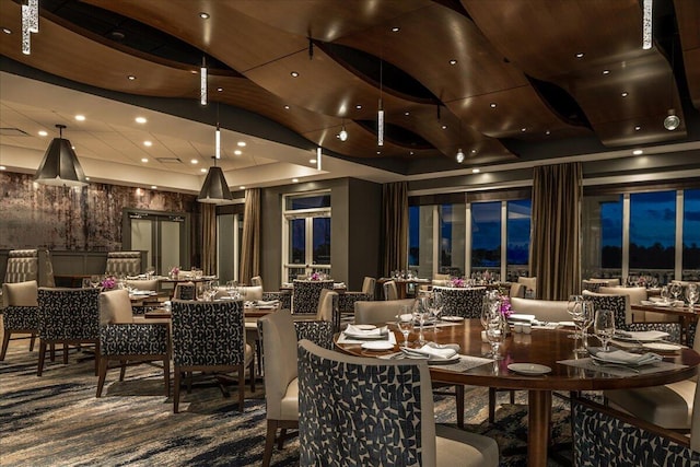 dining space featuring a raised ceiling