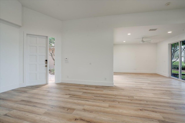 interior space featuring vaulted ceiling, ceiling fan, and light wood-type flooring