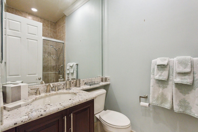 bathroom with vanity, toilet, and walk in shower