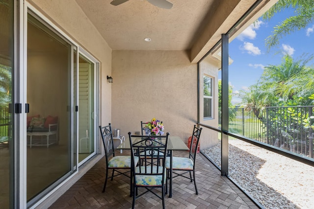 sunroom / solarium with ceiling fan