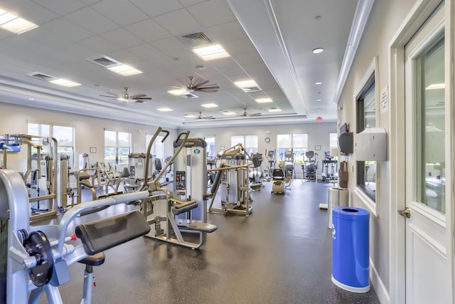 gym with a paneled ceiling