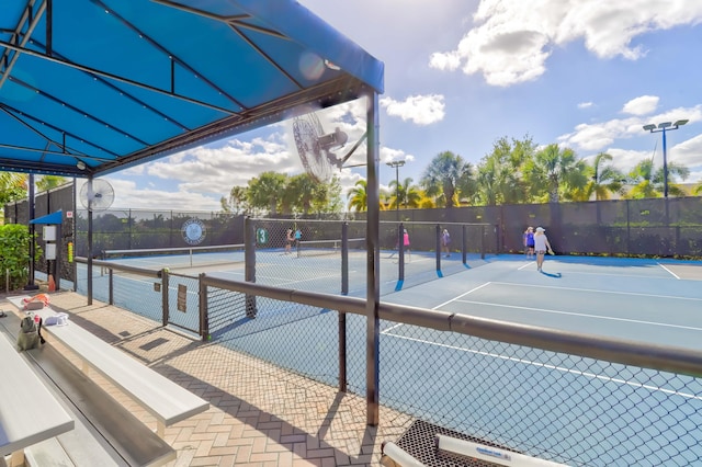 view of sport court with basketball hoop