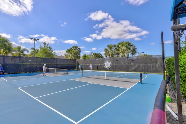 view of tennis court with basketball court