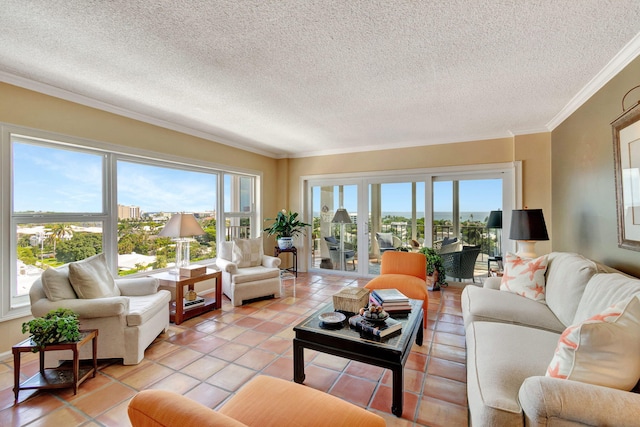 living room featuring plenty of natural light, light tile patterned floors, and a textured ceiling